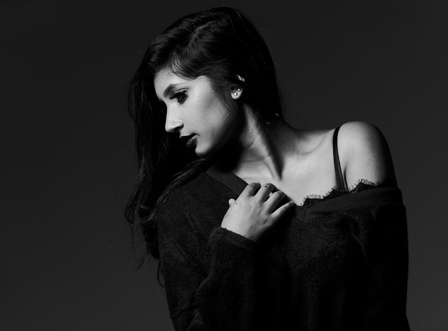 Captivating black and white portrait showcasing a woman's elegance and grace.